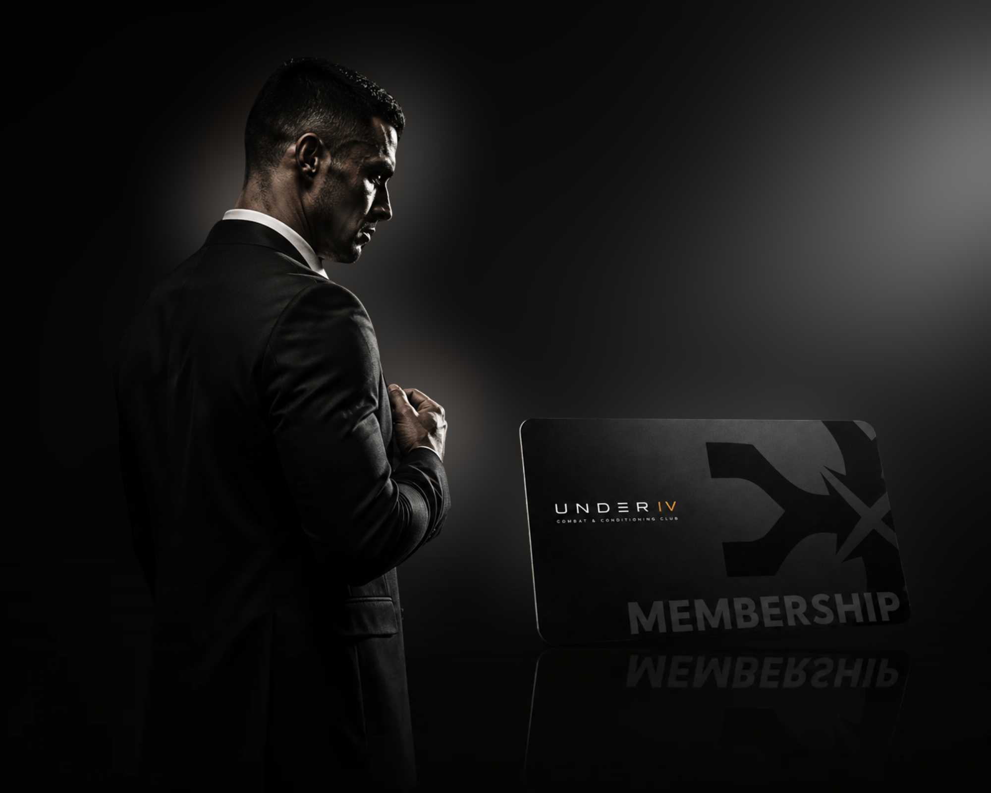 UNDER IV membership card beside a man in a suit